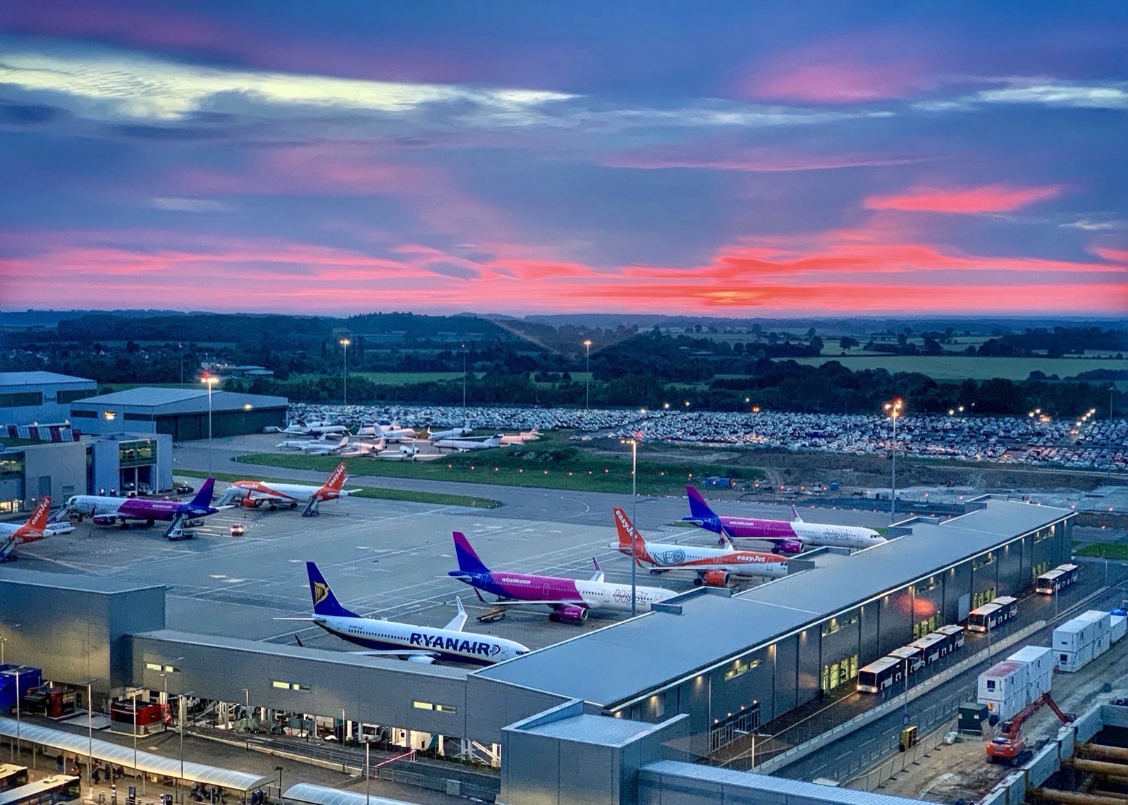 Aircraft at the gates of an airport at dusk