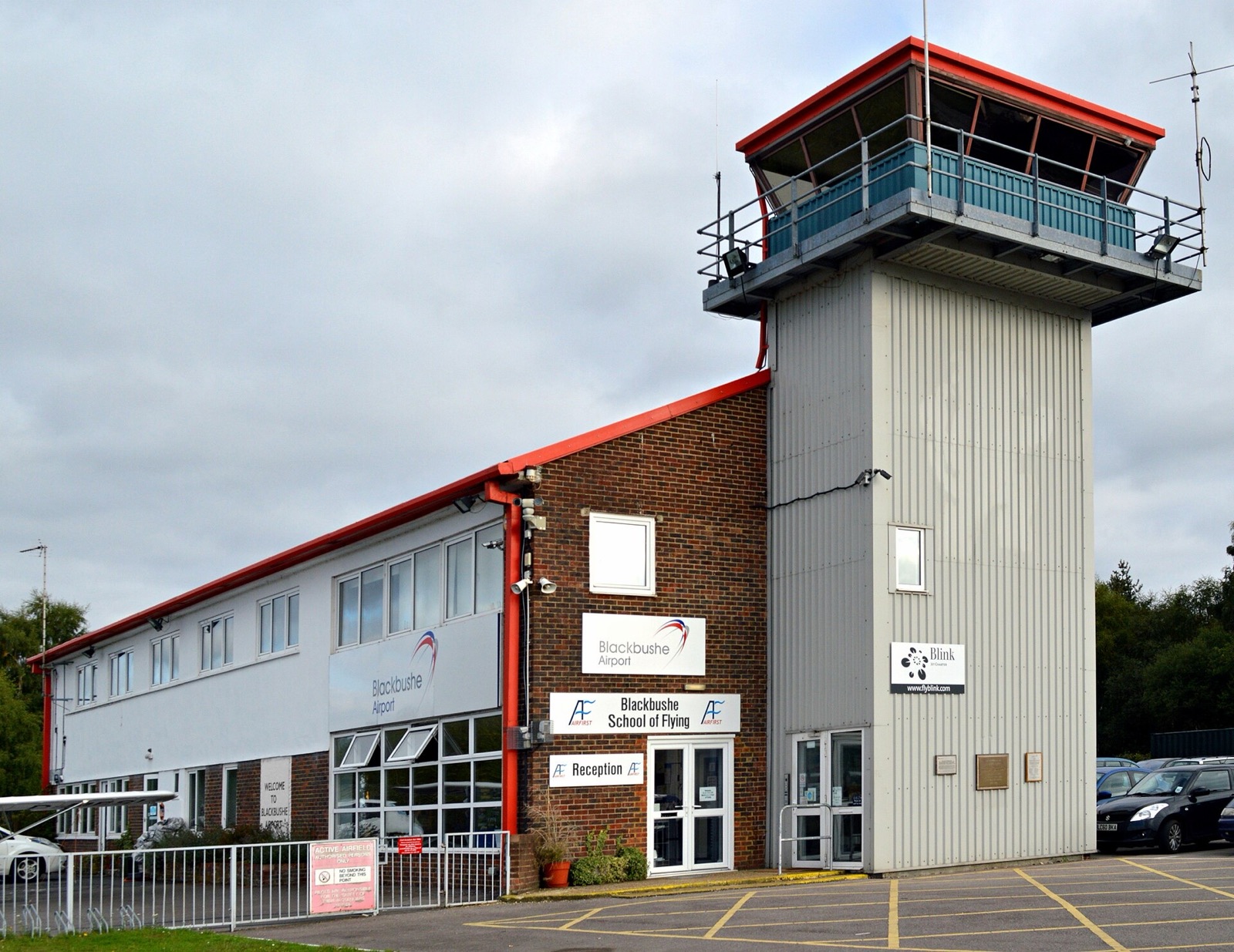 An airport control tower against the sky