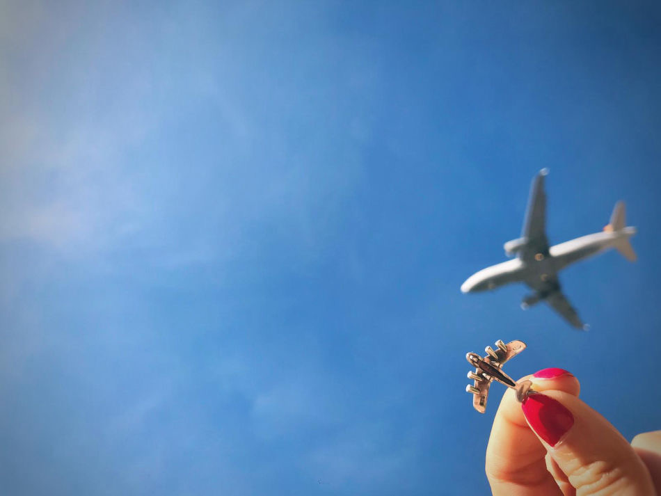 An airliner climbing in a clear sky